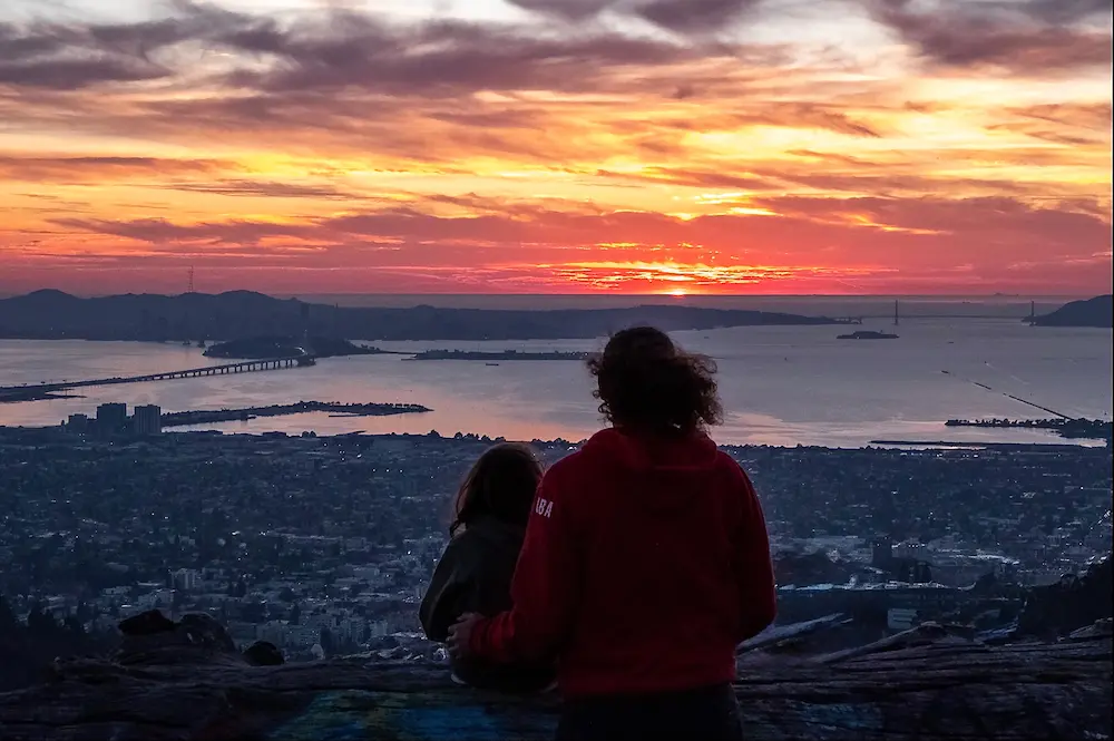 People viewing SF Bay at sunset from high in the Berkeley Hills